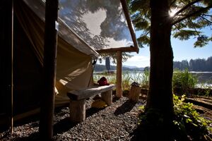 image by Mike Byrne waterfront canvas tent with morning sunshine