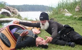 Turner instructing Dagmar on dryland rolling technique