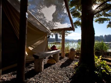 waterfront canvas tent with morning sunshine